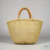Natural woven straw tote bag with leather handles