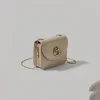 Beige mini crossbody bag with gold chain strap